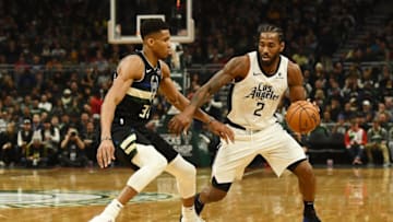 MILWAUKEE, WISCONSIN - DECEMBER 06: Kawhi Leonard #2 of the Los Angeles Clippers drives around Giannis Antetokounmpo #34 of the Milwaukee Bucks during a game at Fiserv Forum on December 06, 2019 in Milwaukee, Wisconsin. NOTE TO USER: User expressly acknowledges and agrees that, by downloading and or using this photograph, User is consenting to the terms and conditions of the Getty Images License Agreement. (Photo by Stacy Revere/Getty Images)