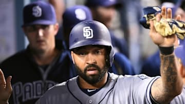 Los Angeles, CA, USA; San Diego Padres right fielder Matt Kemp (27) is greeted in the dugout after scoring a run in the fifth inning against the Los Angeles Dodgers at Dodger Stadium. Mandatory Credit: Jayne Kamin-Oncea-USA TODAY Sports