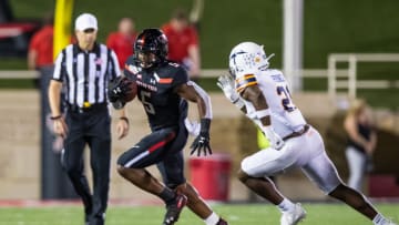 LUBBOCK, TEXAS - SEPTEMBER 07: Running back Armand Shyne #5 of Texas Tech runs with the ball while being pursued by safety Justin Prince #21 of UTEP during the second half of the college football game between the Texas Tech Red Raiders and the UTEP Miners at Jones AT&T Stadium on September 07, 2019 in Lubbock, Texas. (Photo by John E. Moore III/Getty Images)