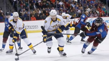 Dec 9, 2014; Denver, CO, USA; Colorado Avalanche center Maxime Talbot (25) shoots the puck past Nashville Predators defenseman Shea Weber (6) during the second period at the at Pepsi Center. Mandatory Credit: Chris Humphreys-USA TODAY Sports