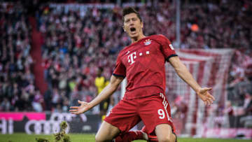 MUNICH, GERMANY - APRIL 06: (EDITORS NOTE: Image has been digitally enhanced) Robert Lewandowski of Muenchen celebrates his team's second goal during the Bundesliga match between FC Bayern Muenchen and Borussia Dortmund at Allianz Arena on April 06, 2019 in Munich, Germany. (Photo by Alex Grimm/Bundesliga/DFL via Getty Images )