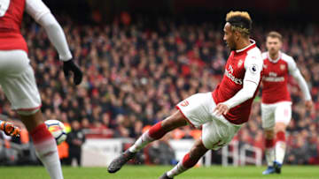 LONDON, ENGLAND - APRIL 01: Pierre-Emerick Aubameyang of Arsenal scores his sides second goal during the Premier League match between Arsenal and Stoke City at Emirates Stadium on April 1, 2018 in London, England. (Photo by Shaun Botterill/Getty Images)