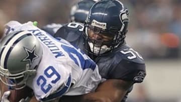 Nov 6, 2011; Arlington, TX, USA; Dallas Cowboys running back DeMarco Murray (29) is tackled by Seattle Seahawks linebacker Leroy Hill (56) at Cowboys Stadium. The Cowboys beat the Seahawks 23-13. Mandatory Credit: Matthew Emmons-USA TODAY Sports