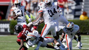 Auburn footballCOLUMBIA, SC - OCTOBER 17: Jamien Sherwood #20 of the Auburn Tigers tackles Shi Smith #13 of the South Carolina Gamecocks in the third quarter of the game at Williams-Brice Stadium on October 17, 2020 in Columbia, South Carolina. The Gamecocks won 30-22. (Photo by Joe Robbins/Getty Images)