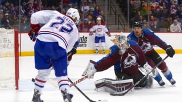 Dec 1, 2014; Denver, CO, USA; Montreal Canadiens right wing Dale Weise (22) takes a shot against Colorado Avalanche goalie Calvin Pickard (31) and defenseman Jan Hejda (8) in the third period at Pepsi Center. Mandatory Credit: Isaiah J. Downing-USA TODAY Sports