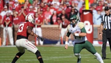 Nov 8, 2014; Norman, OK, USA; Baylor Bears quarterback Bryce Petty (14) runs the ball while being pursued by Oklahoma Sooners safety Ahmad Thomas (13) during the first half at Gaylord Family - Oklahoma Memorial Stadium. Mandatory Credit: Mark D. Smith-USA TODAY Sports