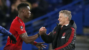 Ole Gunnar Solskjaer and Paul Pogba, Manchester United (Photo by KINGTON/AFP via Getty Images)