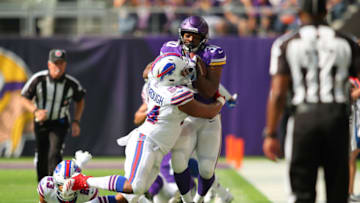 MINNEAPOLIS, MN - SEPTEMBER 23: C.J. Ham #30 of the Minnesota Vikings is tackled with the ball by Eddie Yarbrough #54 of the Buffalo Bills in the fourth quarter of the game at U.S. Bank Stadium on September 23, 2018 in Minneapolis, Minnesota. (Photo by Adam Bettcher/Getty Images)