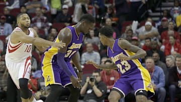 Dec 7, 2016; Houston, TX, USA; Houston Rockets guard Eric Gordon (10) reaches in against Los Angeles Lakers forward Julius Randle (30) in the first quarter at Toyota Center. Mandatory Credit: Thomas B. Shea-USA TODAY Sports
