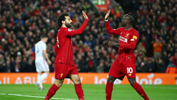 LIVERPOOL, ENGLAND - JANUARY 02: Mohamed Salah of Liverpool celebrates with Sadio Mane after scoring his team's first goal during the Premier League match between Liverpool FC and Sheffield United at Anfield on January 02, 2020 in Liverpool, United Kingdom. (Photo by Clive Brunskill/Getty Images)