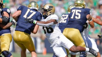 SOUTH BEND, IN - SEPTEMBER 18: Jaylan Alexander #36 of the Purdue Boilermakers makes the sack on Jack Coan #17 of the Notre Dame Fighting Irish during the first quarter at Notre Dame Stadium on September 18, 2021 in South Bend, Indiana. (Photo by Michael Hickey/Getty Images)