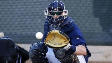 Feb 21, 2016; Maryvale, AZ, USA; Milwaukee Brewers catcher Jonathan Lucroy (20) works out in the bullpen during spring training camp at Maryvale Baseball Park. Mandatory Credit: Rick Scuteri-USA TODAY Sports