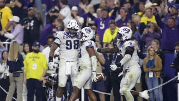 GLENDALE, ARIZONA - DECEMBER 31: Dee Winters #13 of the TCU Horned Frogs celebrates after returning an interception for a touchdown during the third quarter against the Michigan Wolverines in the Vrbo Fiesta Bowl at State Farm Stadium on December 31, 2022 in Glendale, Arizona. (Photo by Chris Coduto/Getty Images)