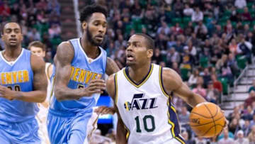 Dec 18, 2015; Salt Lake City, UT, USA; Denver Nuggets forward Will Barton (5) defends against Utah Jazz guard Alec Burks (10) during the second half at Vivint Smart Home Arena. The Jazz won 97-88. Mandatory Credit: Russ Isabella-USA TODAY Sports