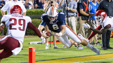 Jarrett Stidham came up short on this run, but later scored on a run against Arkansas. (Photo by Michael Chang/Getty Images)