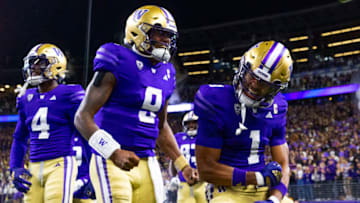 Sep 23, 2023; Seattle, Washington, USA; Washington Huskies wide receiver Rome Odunze (1) celebrates with quarterback Michael Penix Jr. (9) after returning a punt for a touchdown during the first quarter at Alaska Airlines Field at Husky Stadium. Mandatory Credit: Joe Nicholson-USA TODAY Sports