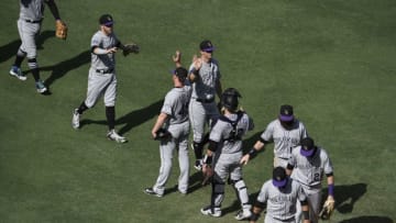 SAN DIEGO, CA - SEPTEMBER 2: Colorado Rockies players high-five after beating the San Diego Padres 7-3 in a baseball game at PETCO Park on September 2, 2018 in San Diego, California. (Photo by Denis Poroy/Getty Images)