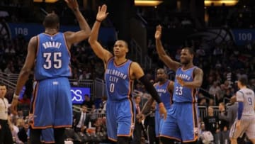 Jan 18, 2015; Orlando, FL, USA; Oklahoma City Thunder forward Kevin Durant (35) and Oklahoma City Thunder guard Russell Westbrook (0) high five against the Orlando Magic during the second quarter at Amway Center. Mandatory Credit: Kim Klement-USA TODAY Sports