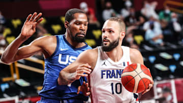 SAITAMA, JAPAN - JULY 25: Kevin Durant (L) of USA in action against Evan Fournier (10) of France during the Group A basketball match between USA and France within the Tokyo 2020 Olympic Games at the Saitama Super Arena in Saitama, Japan on July 25, 2021. (Photo by Elif Ozturk Ozgoncu/Anadolu Agency via Getty Images)