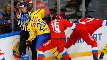 MOSCOW, RUSSIA - DECEMBER 15 : Sergei Plotnikov (16) of Russia in action against Oskar Lindblom (26) of Sweden during the Euro Hockey tour Channel One Cup match between Sweden and Russia at the VTB Ice Palace in Moscow, Russia, on December 15, 2016. (Photo by Sefa Karacan/Anadolu Agency/Getty Images)