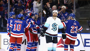 NEW YORK, NEW YORK - FEBRUARY 10: Adam Larsson #6 of the Seattle Kraken looks at the scoreboard as the New York Rangers celebrate a third period goal by Mika Zibanejad #93 at Madison Square Garden on February 10, 2023 in New York City. The Rangers defeated the Kraken 6-3. (Photo by Bruce Bennett/Getty Images)