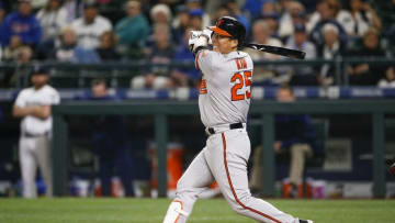 Jun 30, 2016; Seattle, WA, USA; Baltimore Orioles left fielder Hyun Soo Kim (25) hits an RBI-single against the Seattle Mariners during the eighth inning at Safeco Field. Mandatory Credit: Joe Nicholson-USA TODAY Sports