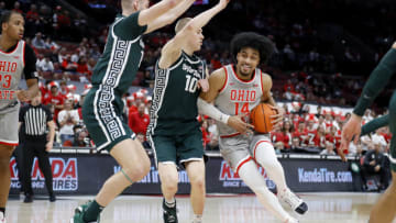 Feb 12, 2023; Columbus, Ohio, USA; Ohio State Buckeyes forward Justice Sueing (14) looks to score as Michigan State Spartans forward Joey Hauser (10) defends during the second half at Value City Arena. Mandatory Credit: Joseph Maiorana-USA TODAY Sports
