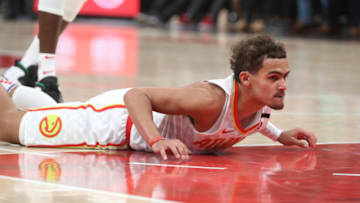 Mar 11, 2020; Atlanta, Georgia, USA; Atlanta Hawks guard Trae Young (11) hits the floor after being fouled against the New York Knicks in the second half at State Farm Arena. Mandatory Credit: Jason Getz-USA TODAY Sports