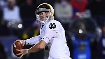 EVANSTON, IL - NOVEMBER 03: Ian Book #12 of the Notre Dame Fighting Irish looks to pass during the second half of a game against the Northwestern Wildcats at Ryan Field on November 3, 2018 in Evanston, Illinois. (Photo by Stacy Revere/Getty Images)