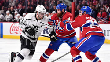 MONTREAL, QC - OCTOBER 26: Anze Kopitar #11 of the Los Angeles Kings tries to squeeze past Jordie Benn #8 and Karl Alzner #22 of the Montreal Canadiens during the NHL game at the Bell Centre on October 26, 2017 in Montreal, Quebec, Canada. The Los Angeles Kings defeated the Montreal Canadiens 4-0. (Photo by Minas Panagiotakis/Getty Images)
