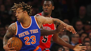 Mar 24, 2016; New York, NY, USA; New York Knicks forward Derrick Williams (23) dribbles the ball around Chicago Bulls forward Bobby Portis (5) during first half at Madison Square Garden. Mandatory Credit: Noah K. Murray-USA TODAY Sports