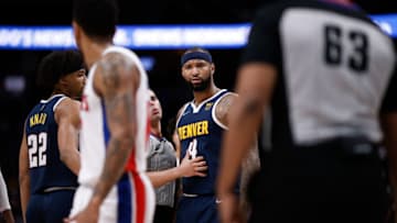 Denver Nuggets center DeMarcus Cousins (4) reacts to Detroit Pistons guard Rodney McGruder (17) as referee Andy Nagy (83) and forward Zeke Nnaji (22) and referee Derek Richardson (63) look on in the fourth quarter at Ball Arena on 23 Jan. 2022. (Isaiah J. Downing-USA TODAY Sports)