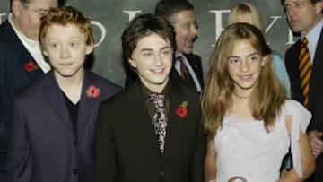 LONDON - NOVEMBER 3: British actors and actress (L-R) Rupert Grint, Daniel Radcliffe and Emma Watson attend the UK film premiere of "Harry Potter and the Chamber of Secrets" at the Leicester Square Odeon cinema on November 3, 2002 in London. (Photo by Dave Hogan/Getty Images)