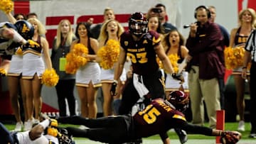 Jan 2, 2016; Phoenix, AZ, USA; Arizona State Sun Devils wide receiver Devin Lucien (15) stretches and scores a touchdown during the first half against the West Virginia Mountaineers at Chase Field during the Cactus Bowl. Mandatory Credit: Matt Kartozian-USA TODAY Sports