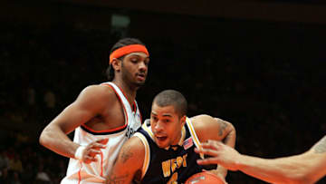 NEW YORK - MARCH 12: Darryl Watkins #13 of the Syracuse Orangemen defends Frank Young #21 of the West Virginia Mountaineers during the the Big East Men's Basketball Championship Game on March 12, 2005 at Madison Square Garden in New York City. (Photo by Jim McIsaac/Getty Images)