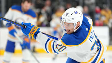 Dec 19, 2022; Las Vegas, Nevada, USA; Buffalo Sabres defenseman Lawrence Pilut (20) warms up before a game against the Vegas Golden Knights at T-Mobile Arena. Mandatory Credit: Stephen R. Sylvanie-USA TODAY Sports