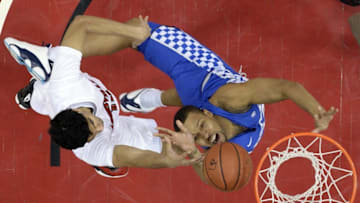 Dec 21, 2016; Louisville, KY, USA; Louisville Cardinals forward Anas Mahmoud (14) blocks the shot of Kentucky Wildcats guard Isaiah Briscoe (13) during the first half at KFC Yum! Center. Louisville defeated Kentucky 73-70. Mandatory Credit: Jamie Rhodes-USA TODAY Sports