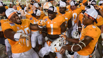 BRISTOL, TN - SEPTEMBER 10: Defensive lineman Kahlil McKenzie #99, defensive lineman Jonathan Kongbo #1, and defensive back Justin Martin #8 of the Tennessee Volunteers celebrate following their victory against the Virginia Tech Hokies at Bristol Motor Speedway on September 10, 2016 in Bristol, Tennessee. Tennessee defeated Virginia Tech 45-24. (Photo by Michael Shroyer/Getty Images)
