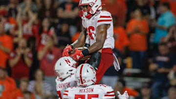 CHAMPAIGN, IL - SEPTEMBER 21: Dedrick Mills #26 of the Nebraska Cornhuskers is hoisted in the air by Matt Farniok #71 of the Nebraska Cornhuskers as they celebrate a touchdown against the Illinois Fighting Illini during the second half at Memorial Stadium on September 21, 2019 in Champaign, Illinois. (Photo by Michael Hickey/Getty Images)
