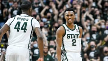 Michigan State's Tyson Walker, right, celebrates with Gabe Brown after Walker's 3 pointer against Purdue during the second half on Saturday, Feb. 26, 2022, at the Breslin Center in East Lansing.220226 Msu Purdue 315a