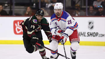 TEMPE, ARIZONA - OCTOBER 30: Chris Kreider #20 of the New York Rangers and Shayne Gostisbehere #14 of the Arizona Coyotes skate after the puck during the NHL game at Mullett Arena on October 30, 2022 in Tempe, Arizona. The Rangers defeated the Coyotes 3-2. (Photo by Christian Petersen/Getty Images)