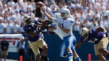 PROVO, UT - SEPTEMBER 21 : Zach Wilson #1 of the BYU Cougars is pressured by Myles Rice #41 and Sam Taimani #94 of the Washington Huskies during their game at LaVell Edwards Stadium on September 21, 2019 in Provo, Utah. (Photo by Chris Gardner/Getty Images)
