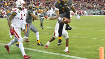 Dec 30, 2016; Nashville , TN, USA; Tennessee Volunteers quarterback Joshua Dobbs (11) scores a touchdown in the fourth quarter against the Nebraska Cornhuskers during the second half at Nissan Stadium. The Volunteers won 38-24. Mandatory Credit: Jim Brown-USA TODAY Sports