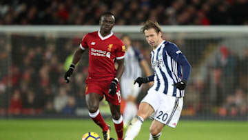 LIVERPOOL, ENGLAND - DECEMBER 13: Grzegorz Krychowiak of West Bromwich Albion competes with Sadio Mane of Liverpool during the Premier League match between Liverpool and West Bromwich Albion at Anfield on December 13, 2017 in Liverpool, England. (Photo by Robbie Jay Barratt - AMA/Getty Images)