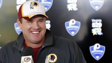Jul 24, 2014; Richmond, VA, USA; Washington Redskins head coach Jay Gruden speaks with the media prior to an afternoon walkthrough on day two of training camp at Bon Secours Washington Redskins Training Center. Mandatory Credit: Geoff Burke-USA TODAY Sports