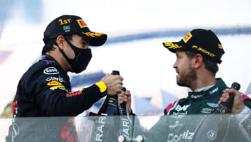Sergio Perez, Red Bull, and Sebastian Vettel, Aston Martin, Formula 1 (Photo by Clive Rose/Getty Images)