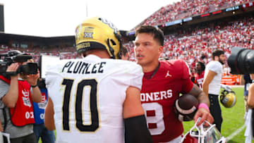 Oct 21, 2023; Norman, Oklahoma, USA; UCF Knights quarterback John Rhys Plumlee (10) shakes hands with Oklahoma Sooners quarterback Dillon Gabriel (8) after the game at Gaylord Family-Oklahoma Memorial Stadium. Mandatory Credit: Kevin Jairaj-USA TODAY Sports