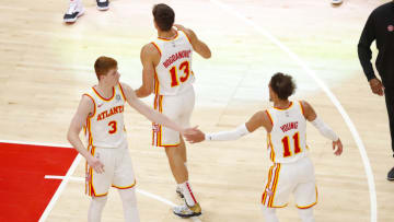 ATLANTA, GA - APRIL 06: Kevin Huerter #3 of the Atlanta Hawks reacts with Trae Young #11 and Bogdan Bogdanovic #13 during the second half against the New Orleans Pelicans at State Farm Arena on April 6, 2021 in Atlanta, Georgia. NOTE TO USER: User expressly acknowledges and agrees that, by downloading and/or using this photograph, user is consenting to the terms and conditions of the Getty Images License Agreement. (Photo by Todd Kirkland/Getty Images)