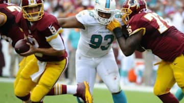 Sep 13, 2015; Landover, MD, USA; Miami Dolphins defensive tackle Ndamukong Suh (93) rushes Washington Redskins quarterback Kirk Cousins (8) during the first half at FedEx Field. Mandatory Credit: Brad Mills-USA TODAY Sports