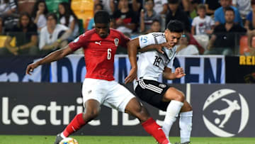 UDINE, ITALY - JUNE 23: Kevin Danso of Austria competes for the ball with Nadiem Amiri of Germany during the 2019 UEFA U-21 Group B match between Austria and Germany at Stadio Friuli on June 23, 2019 in Udine, Italy. (Photo by Alessandro Sabattini/Getty Images)